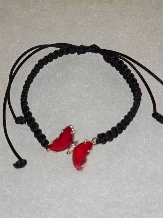 Hand woven black macrame bracelet with red crystal butterfly.