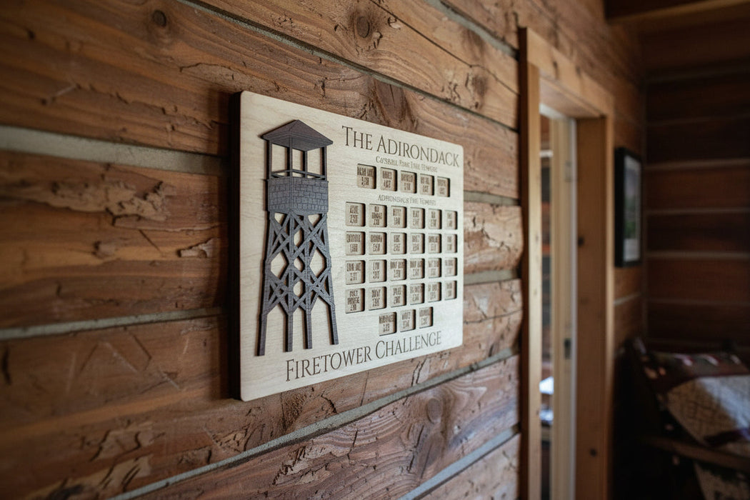 Adirondack Fire Tower Challenge Tracker on a Cabin Wall