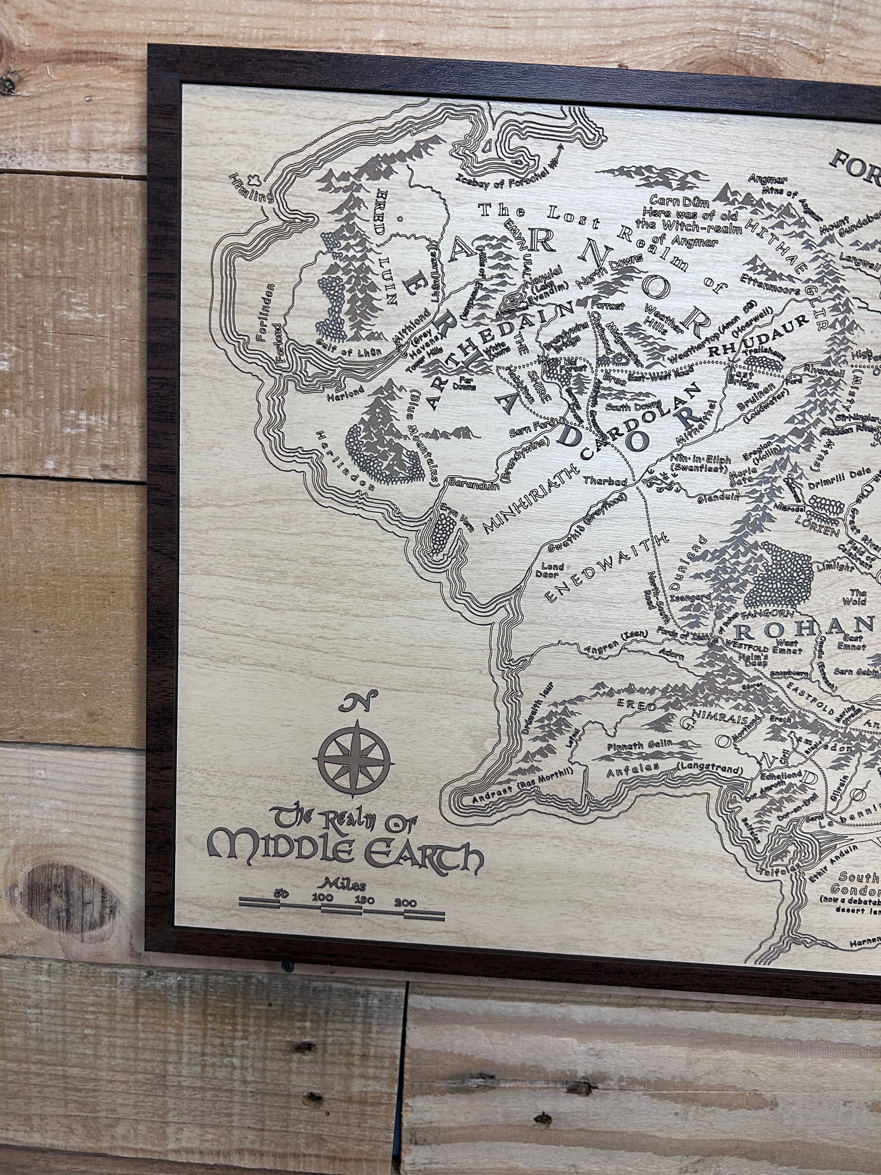 Wooden map of Middle-earth from 'The Lord of the Rings' on a wooden surface