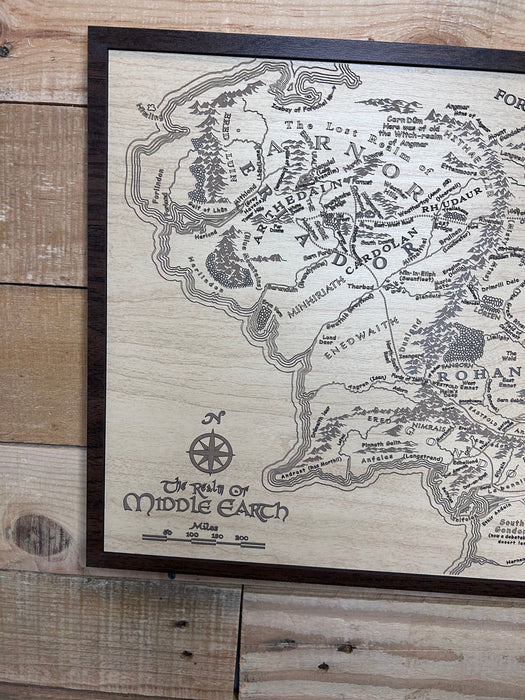 Wooden map of Middle-earth from 'The Lord of the Rings' on a wooden surface