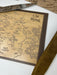 Wooden map of 'The Shire' with a brown frame on a white surface.