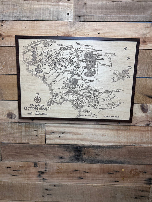 Map of Middle-earth with a Walnut Frame hanging on a wall