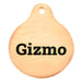 brass charm engraved with the word Gizmo on black