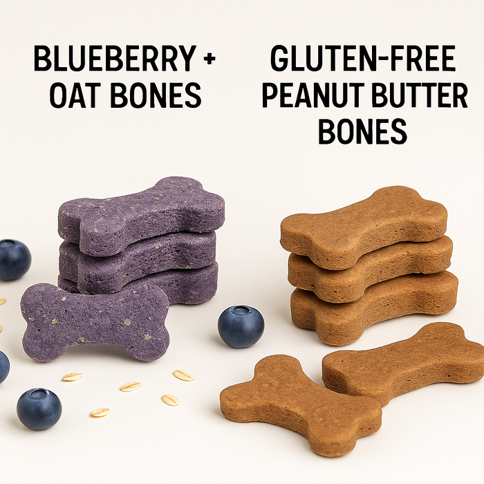 A stack of Gluten-Free Peanut Butter Bones and a stack of Blueberry + Oat Bones. Handmade organic dog treats from 'The Chosen Spot K9 Kitchen' with treats displayed in front along with blueberries and whole grain oats.