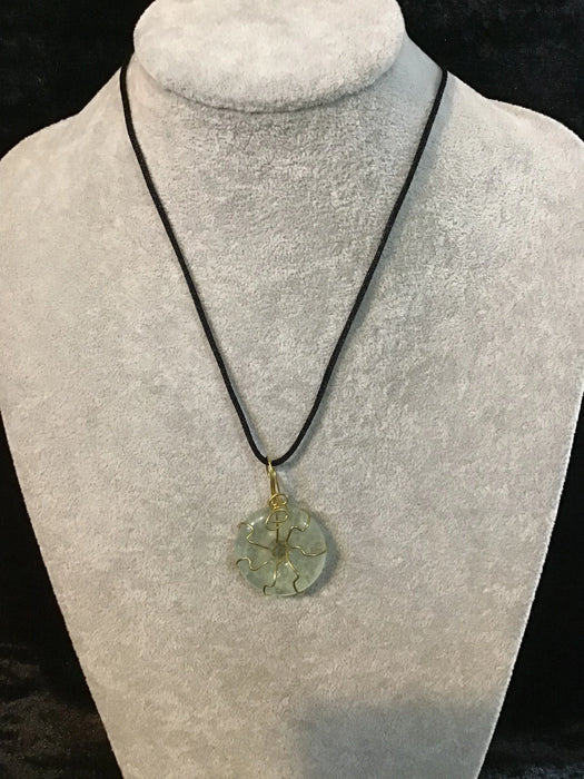 Wire wrapped gemstone donut on 18" black satin adjustable cord.