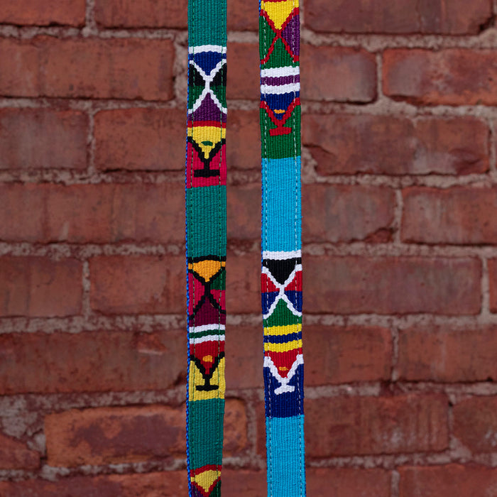 two a tail we could wag leash Moab colorways in front of brick background