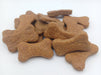 Peanut Butter Bones. Handmade organic dog treats from The Chosen Spot K9 Kitchen on a white background.