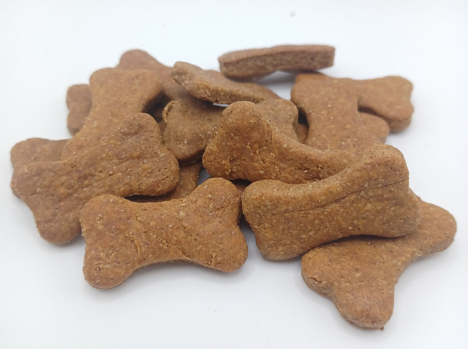 Peanut Butter Bones. Handmade organic dog treats from The Chosen Spot K9 Kitchen on a white background.