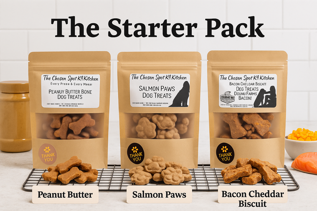 Three packages of dog treats labeled 'Peanut Butter Bone', 'Salmon Paws', and 'Bacon Cheddar Biscuit' on a white surface with a tiled wall background.