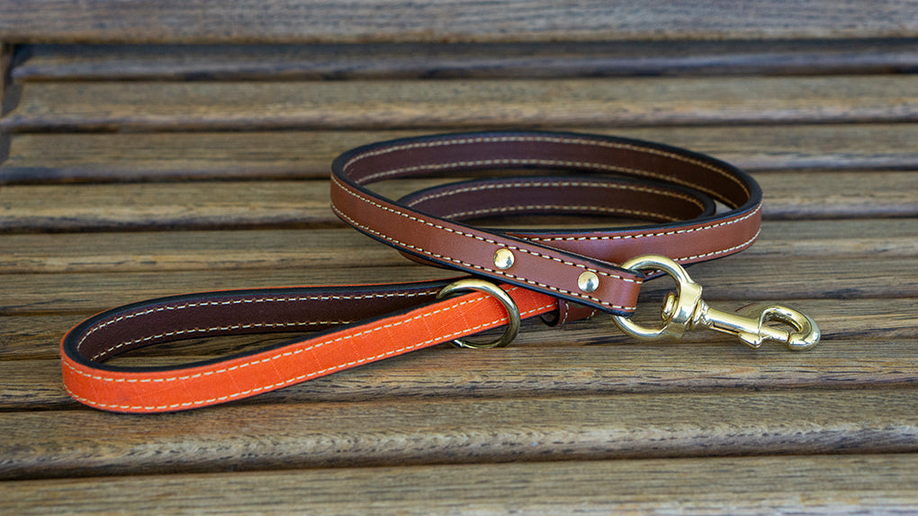 Upland and Downstream leather leash with orange waxed cotton accent and brass hardware
