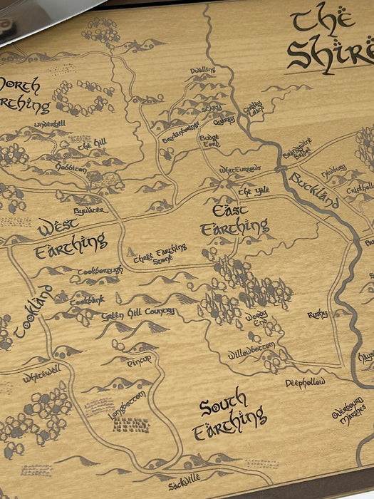 Map of The Shire from 'The Lord of the Rings' on a wooden surface