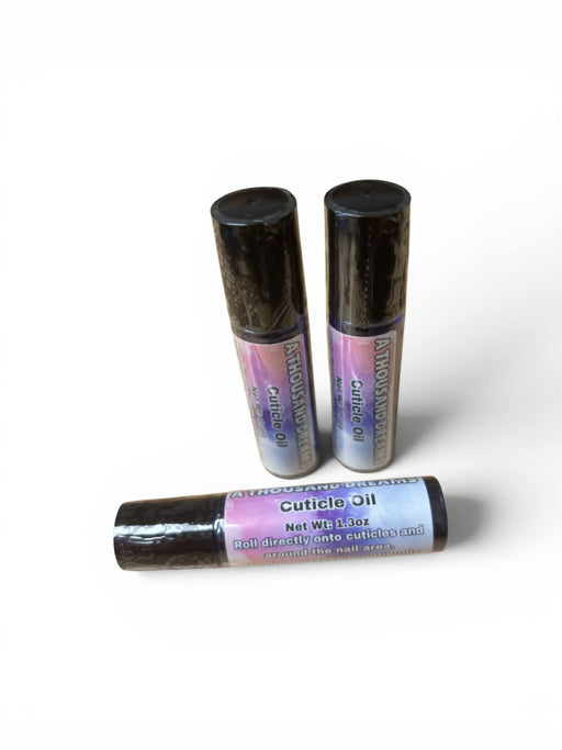 Three bottles of cuticle oil on a white background