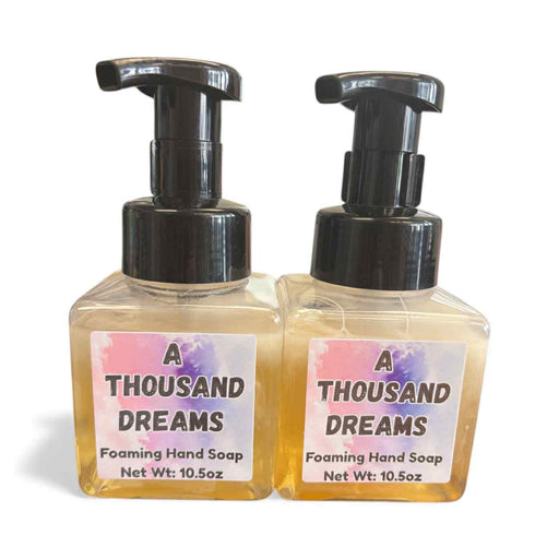 Two bottles of 'A Thousand Dreams' foaming hand soap on a white background