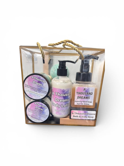 Gift set with 'A Thousand Dreams' products including bottles and containers in a clear bag.