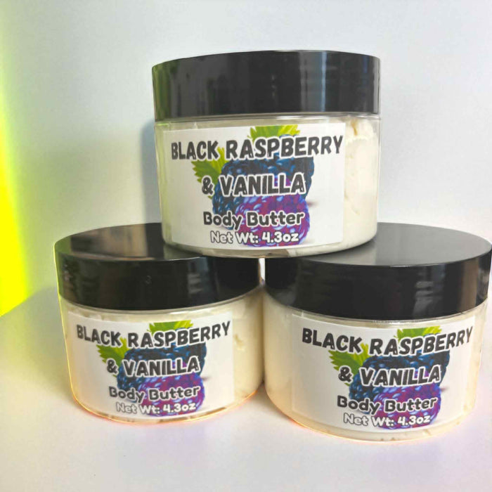 Three jars of black raspberry and vanilla body butter stacked on a white background