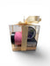 Gift set with black container, and white box wrapped with a gold ribbon on a white background.