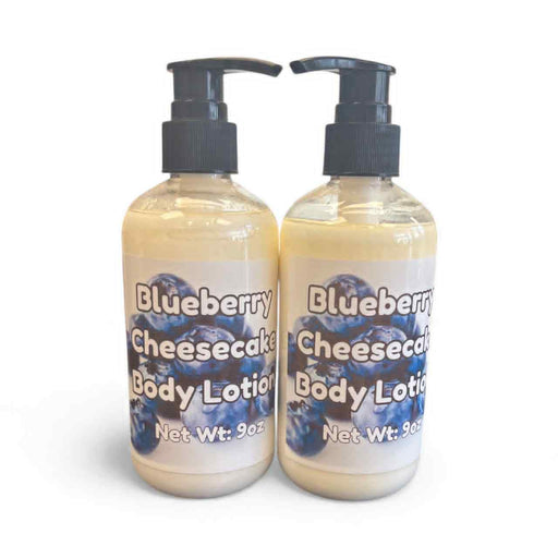 Two bottles of Blueberry Cheesecake body lotion on a white background