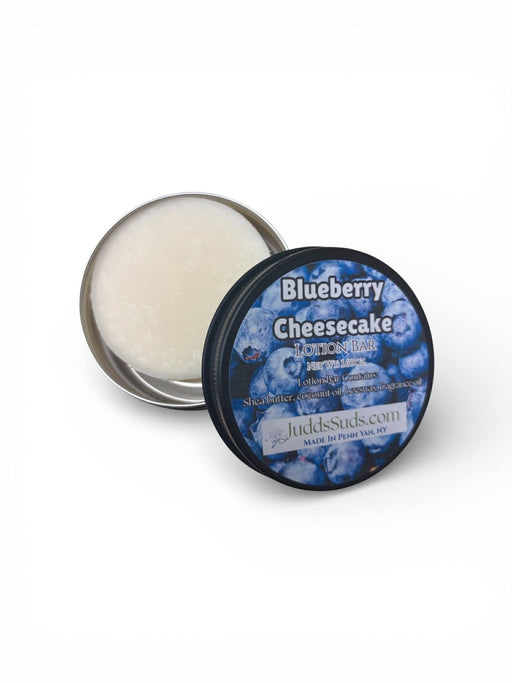 Blueberry Cheesecake scented product in a tin with a blue label on a white background