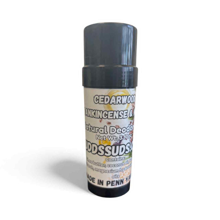 Natural deodorant stick with a gray cap and white label on a white background