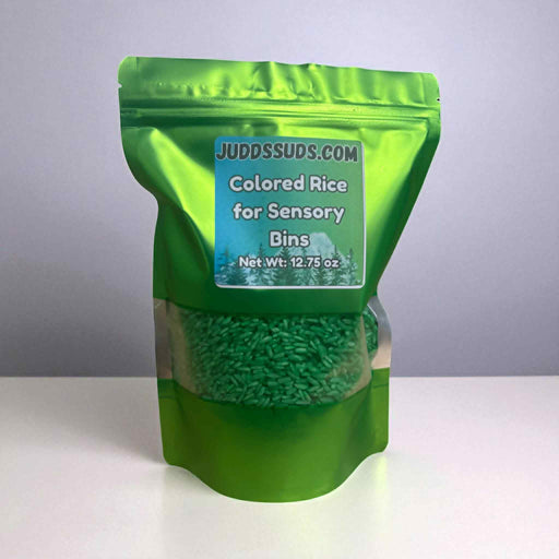 Green package of colored rice for sensory bins with a label on a white background