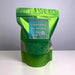 Green package of colored rice for sensory bins with a label on a white background