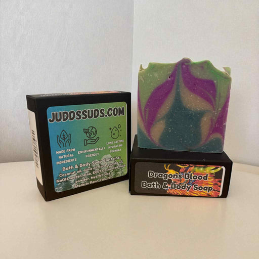 Colorful soap bar with 'Judds Suds' packaging on a white surface