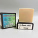 Bar of goat milk soap with packaging displaying 'Judds Suds' branding on a gray background.