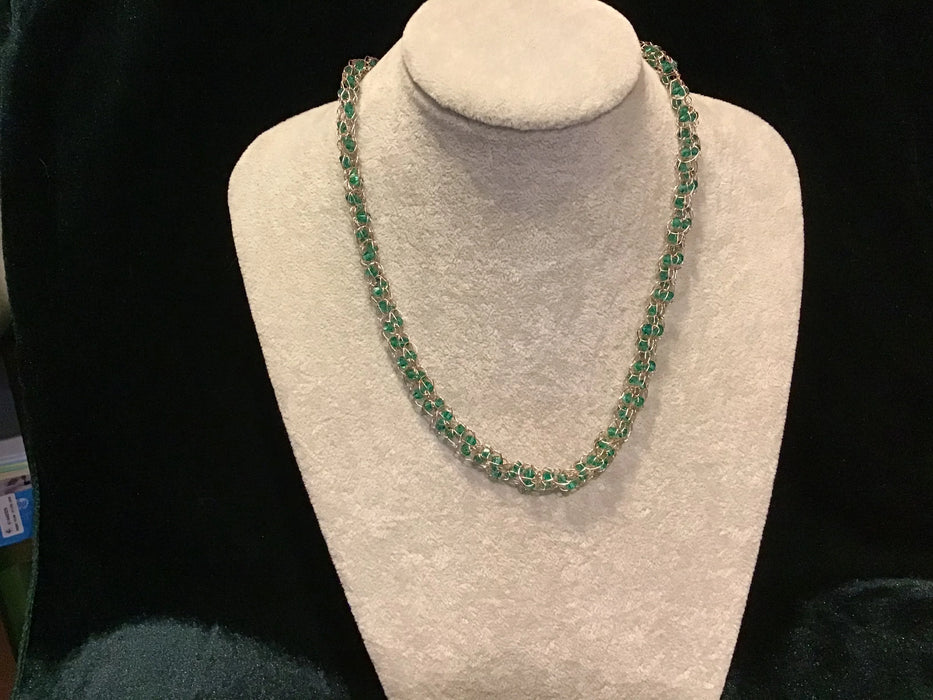 Handwoven chain with crystals.
