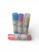 Four lip balms with colorful caps on a white background