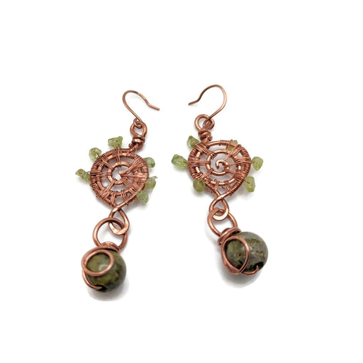 Abstract copper swirls woven and hammered with a green Unakite bead dangling from the bottom.