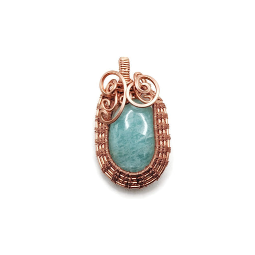 Bright blue Amazonite set in 99.9% copper with an Egyptian-like weave around it.