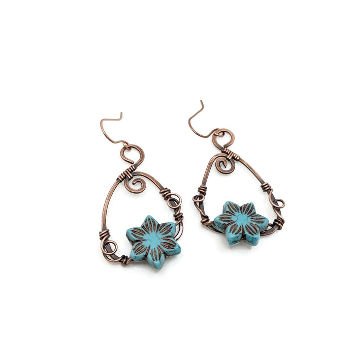 Blue lotus flower  dangle and drop earrings on antiqued copper.