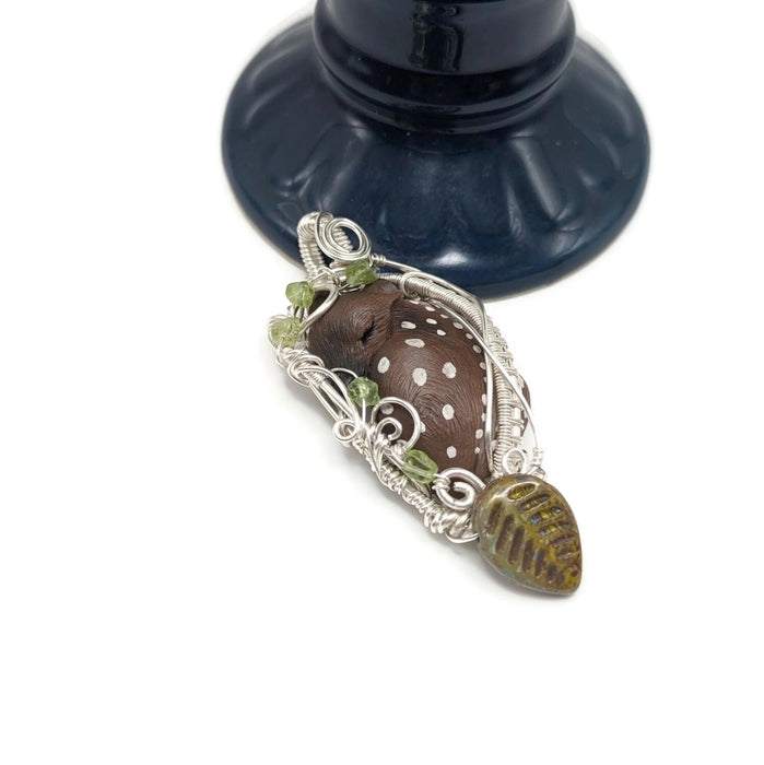 Cute fawn deer pendant in silver filled silver with peridot  and glass leaf accents