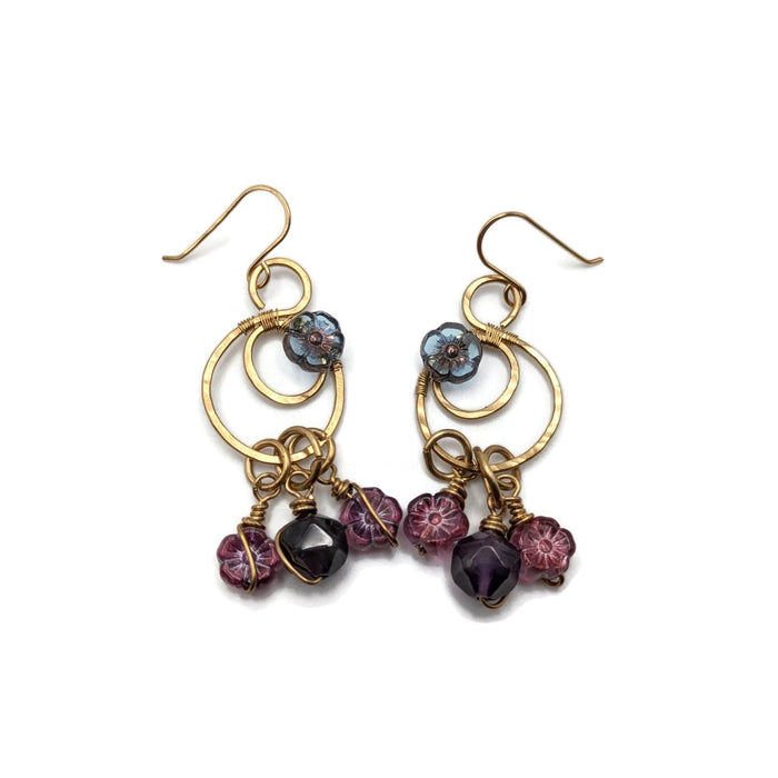 Gold moon drop earrings with vibrant amethyst beads and purple/pink flowers.