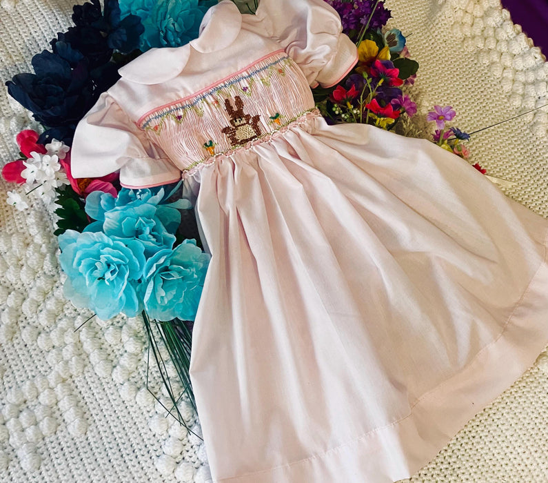 Easter Smocked dress- pink with  bow tie and button closure with  Bunny,  flowers, fully lined bodice.