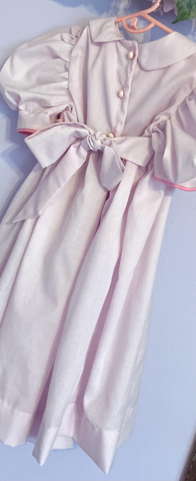 Easter Smocked dress- pink with  bow tie and button closure with  Bunny,  flowers, fully lined bodice.