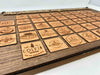 All 46 Adirondack High Peaks cherry tokens laid out — one unique token per peak