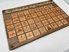 Close-up of cherry wood Adirondack High Peak token showing peak name and elevation engraving
