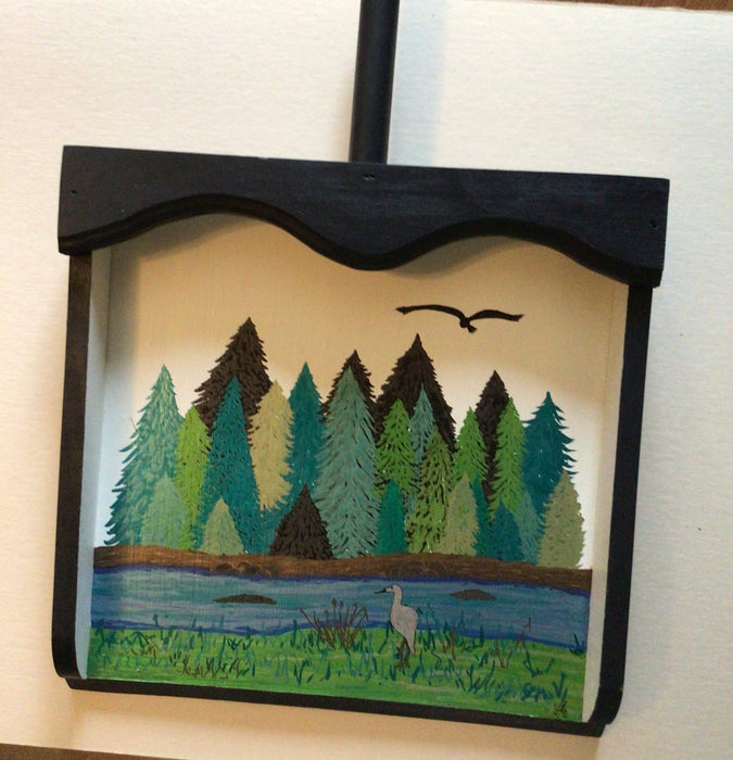 Nature scene on wooden dust pan