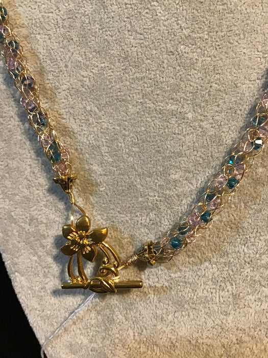 Handwoven chain with crystals.