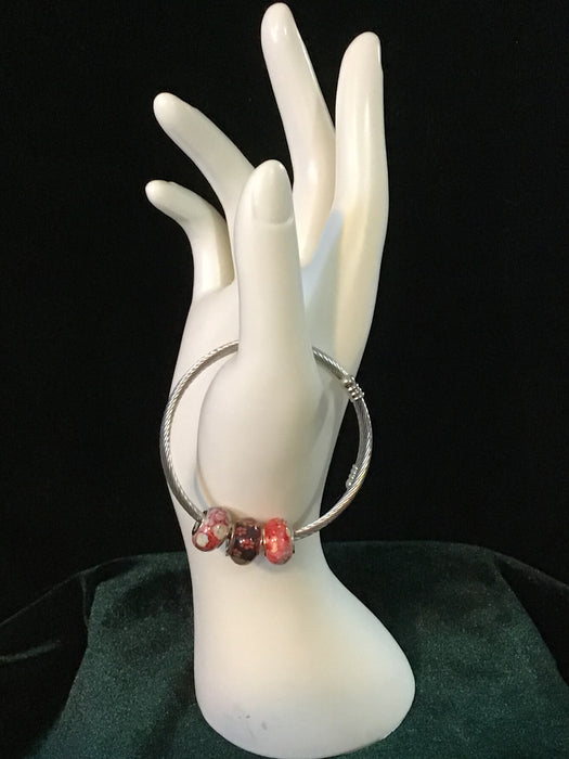 Silver snake bracelet with dog paws bead