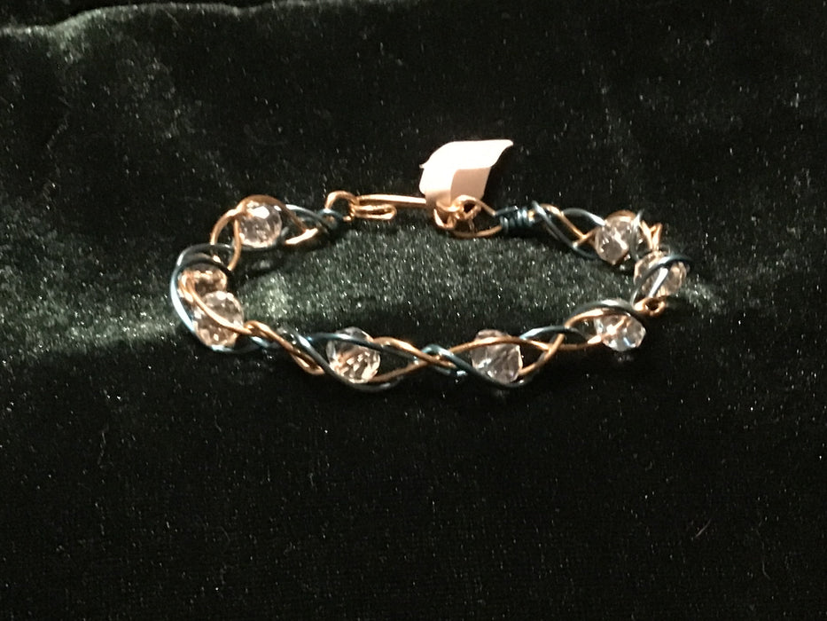 Hand woven wire bracelet cuff.