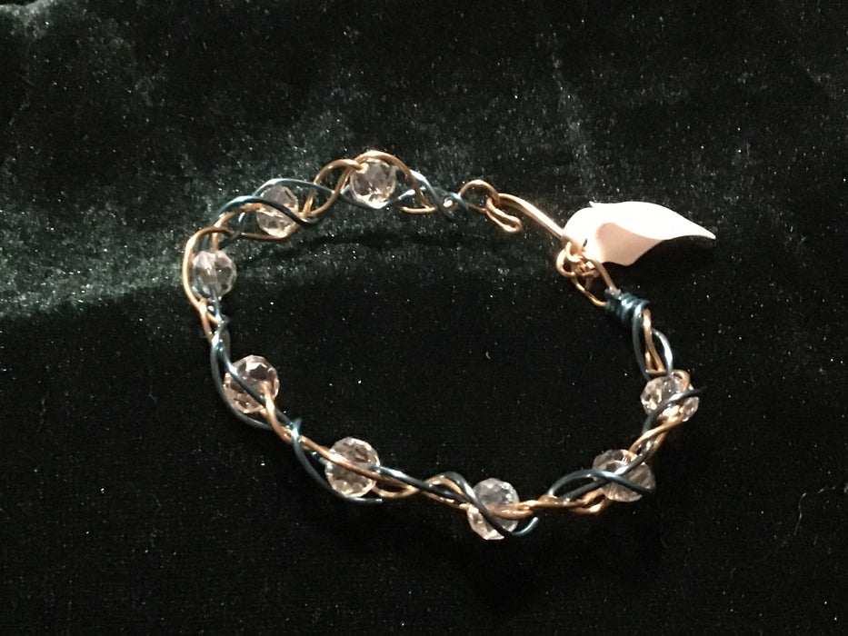 Hand woven wire bracelet cuff.