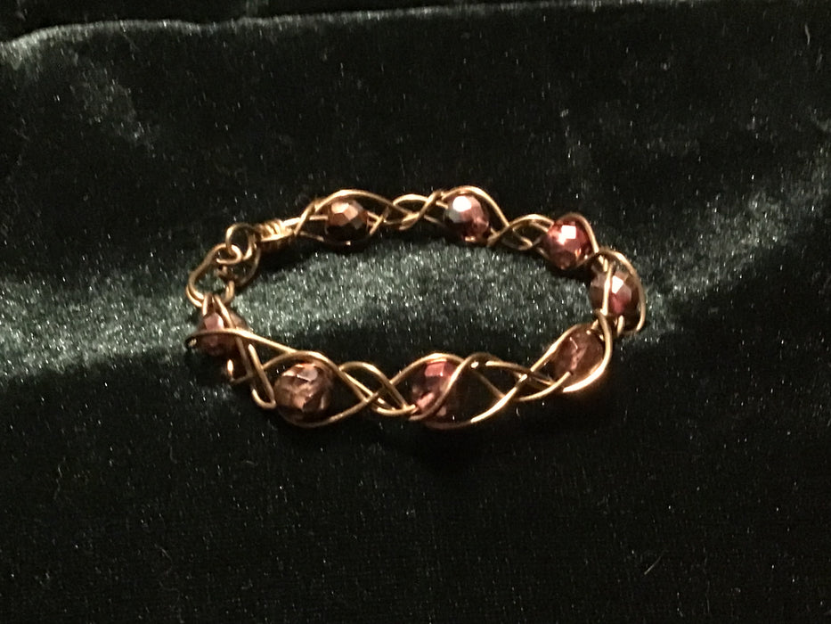Hand woven wire bracelet cuff.