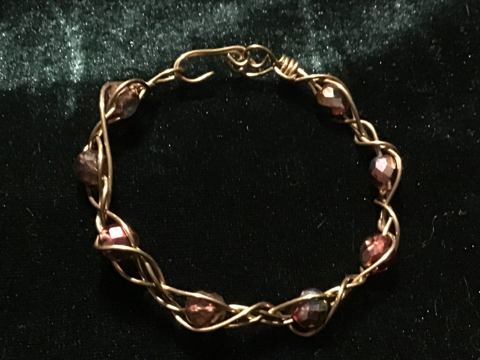 Hand woven wire bracelet cuff.