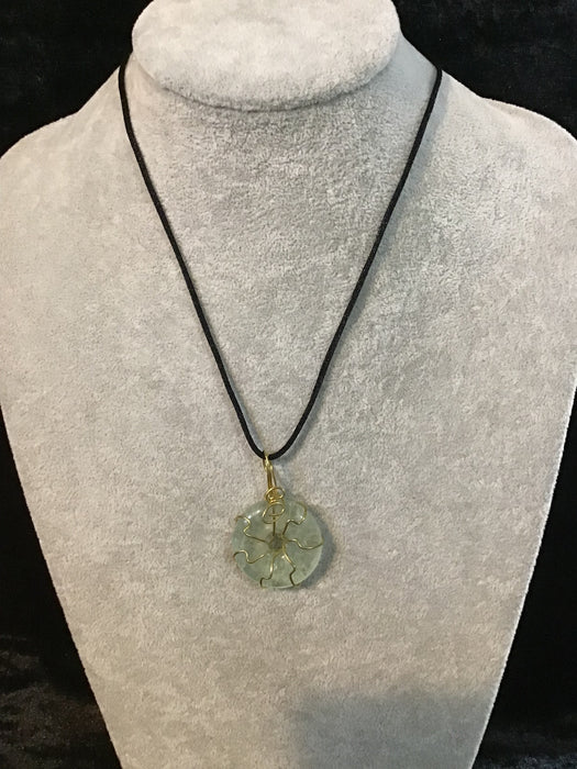 Wire wrapped gemstone donut on18" black satin adjustable cord.