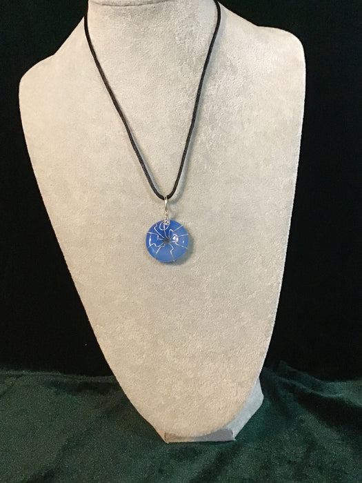 Wire wrapped gemstone donut on18" black satin adjustable cord.