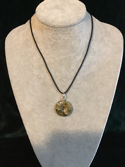 Wire wrapped gemstone donut on18" black satin adjustable cord.