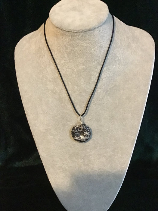 Wire wrapped gemstone donut on18" black satin adjustable cord.