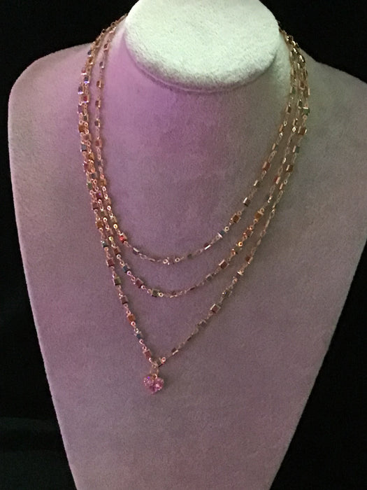 Multi-strand crystal; chain with crystal heart pendant.